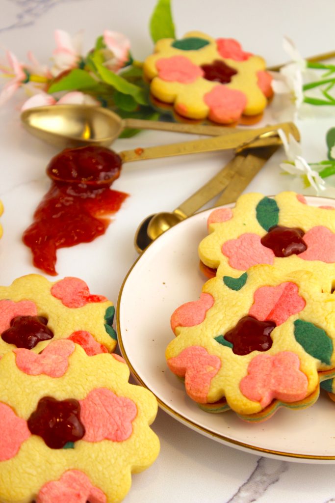 finished product of floral linzer cookies