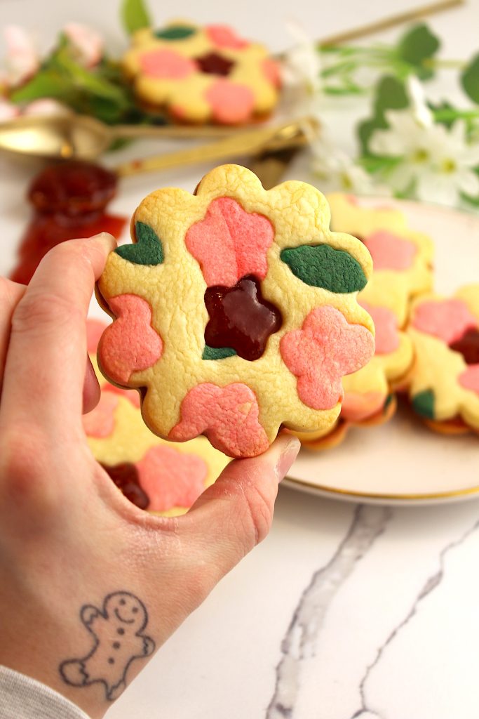 final product flora linzer cookie held up