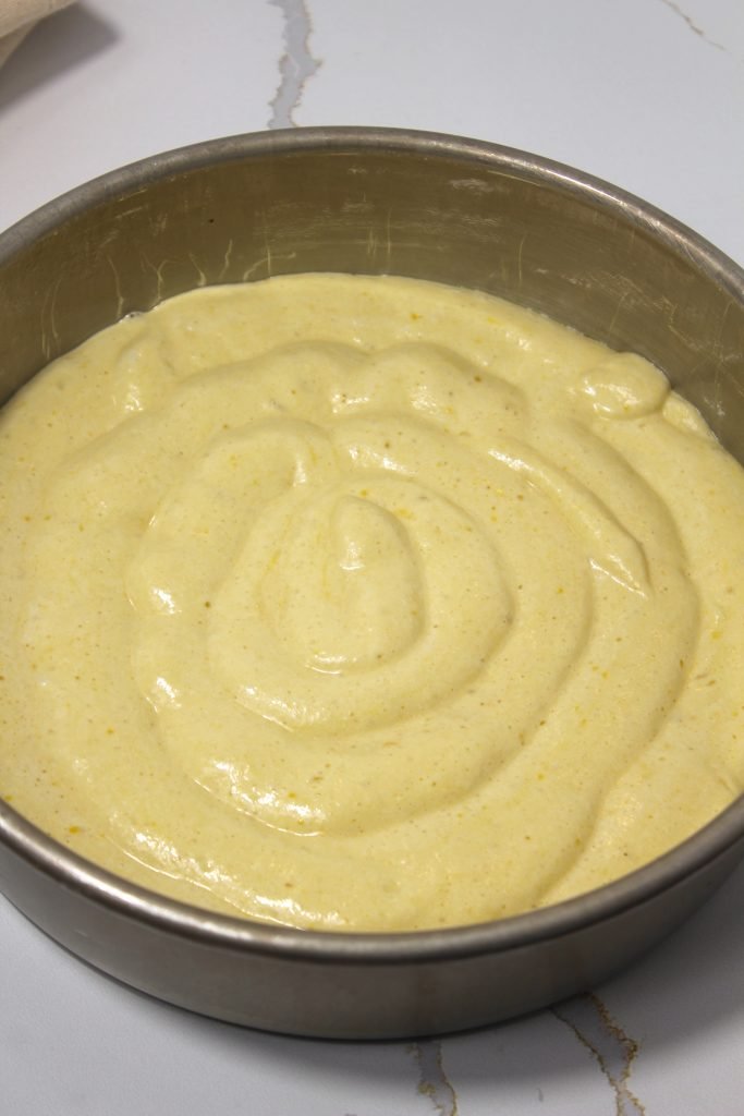 second layer of batter covering design in the pan and ready to bake